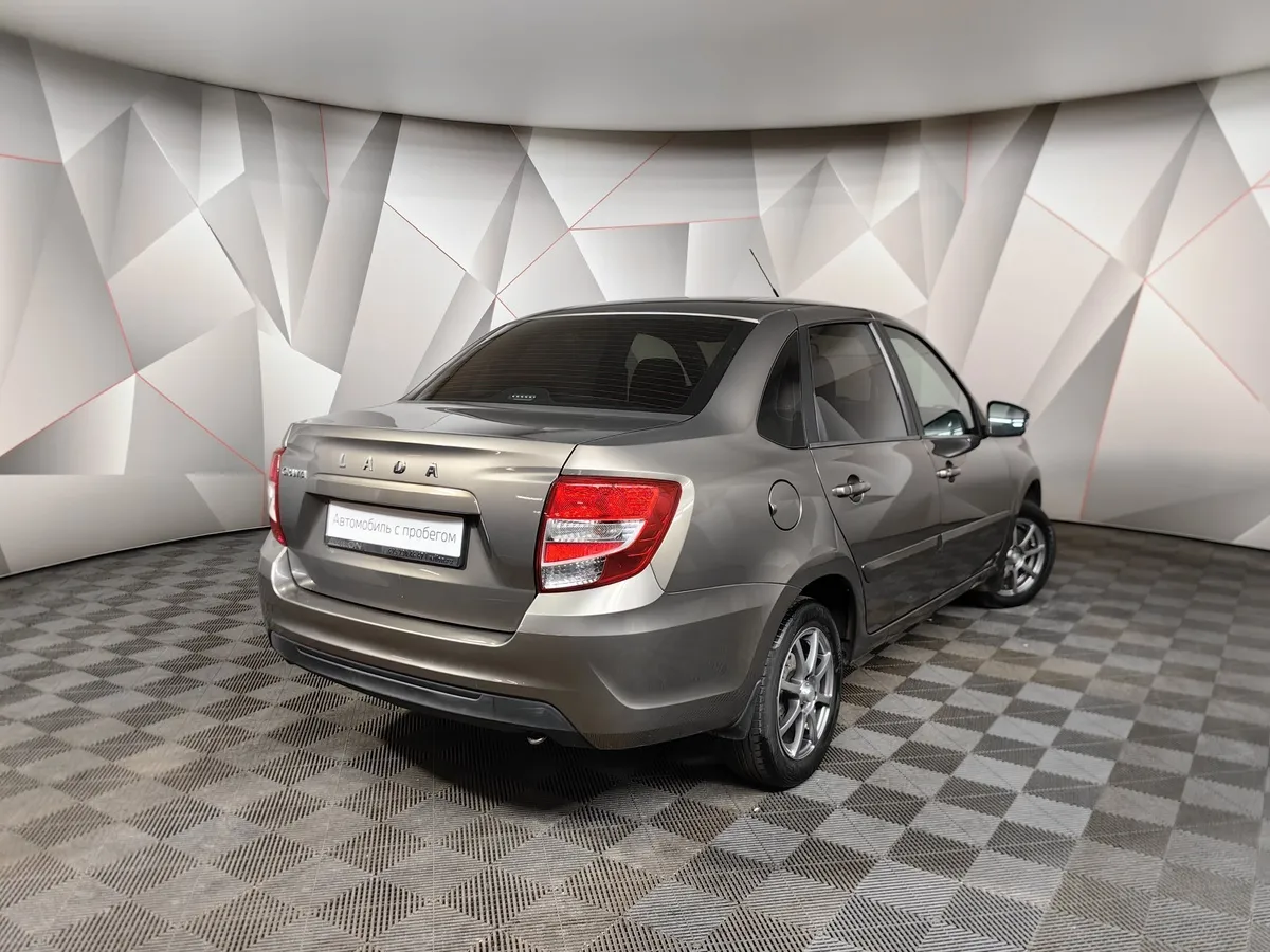 ВАЗ (Lada) Granta 1.6 MT 16 кл (106 л.с.) Коричневый в АВИЛОН. Слайд №2