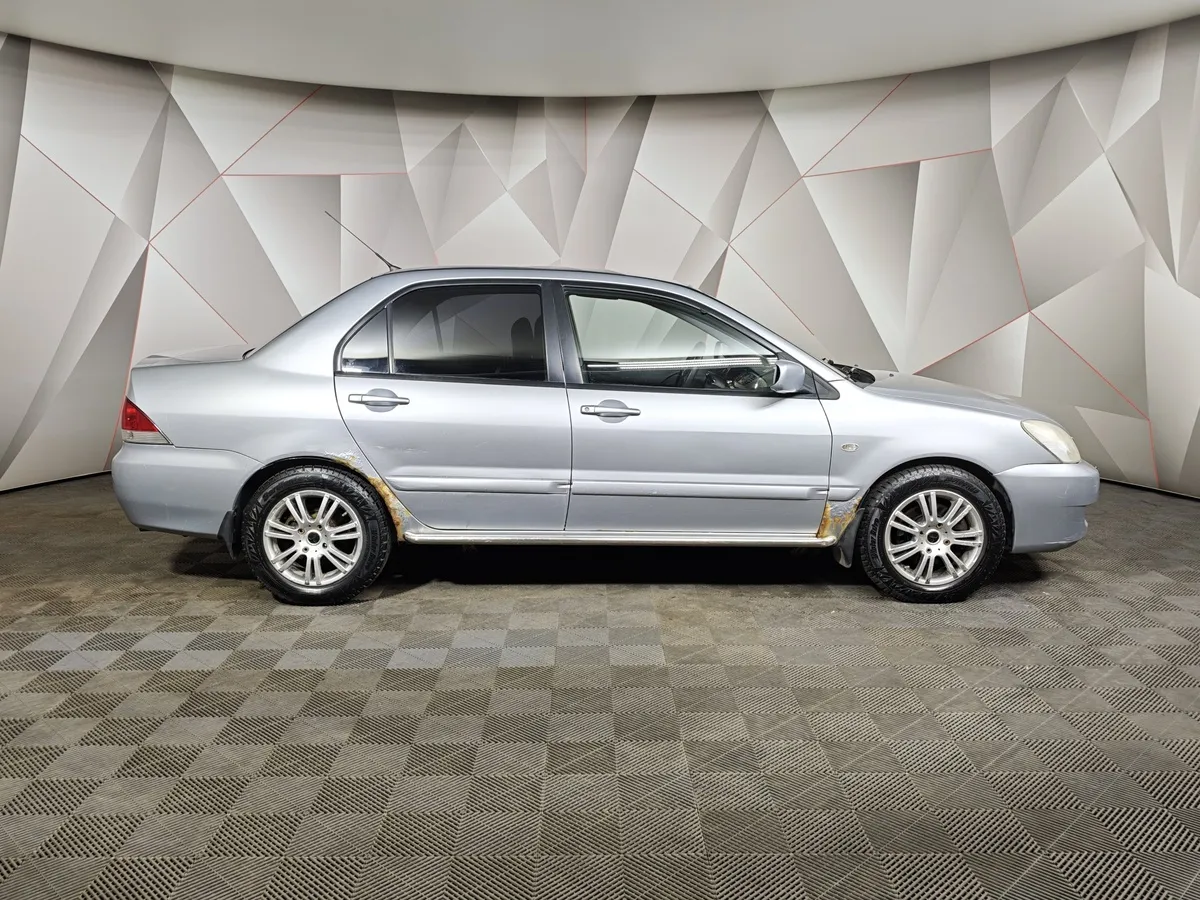 Mitsubishi Lancer 1.6 AT (98 л.с.) Серебристый в АВИЛОН. Слайд №6