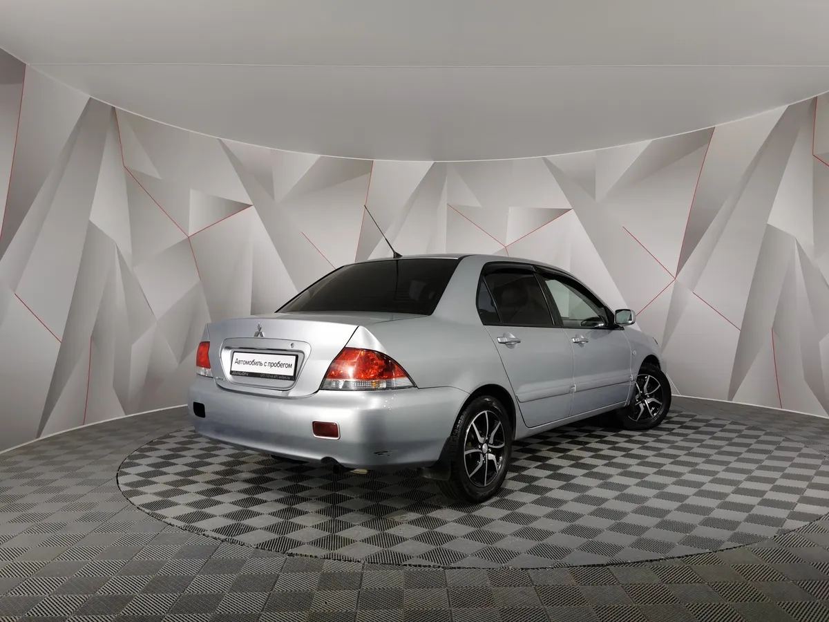 Mitsubishi Lancer 1.6 MT (98 л.с.) Серый в АВИЛОН. Слайд №2