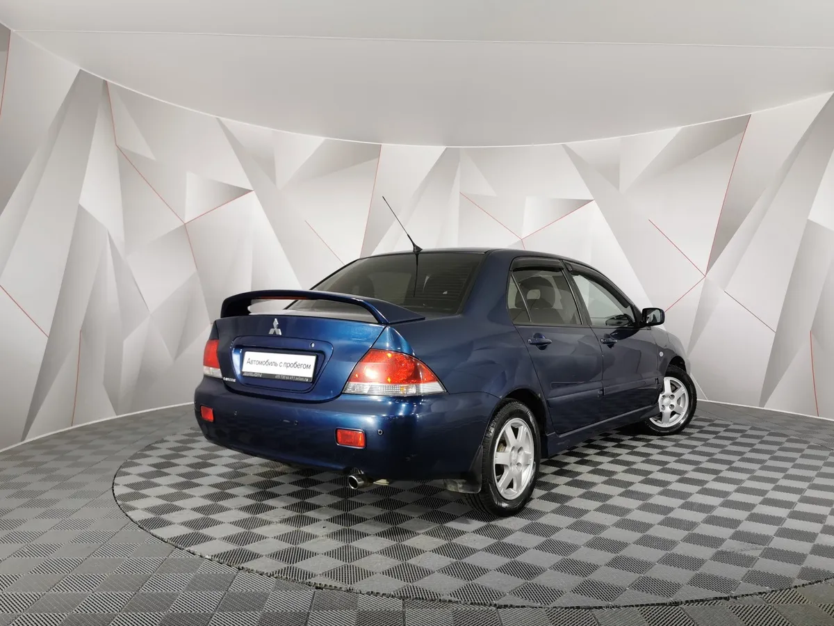 Mitsubishi Lancer 1.6 MT (100 л.с.) Синий в АВИЛОН. Слайд №2