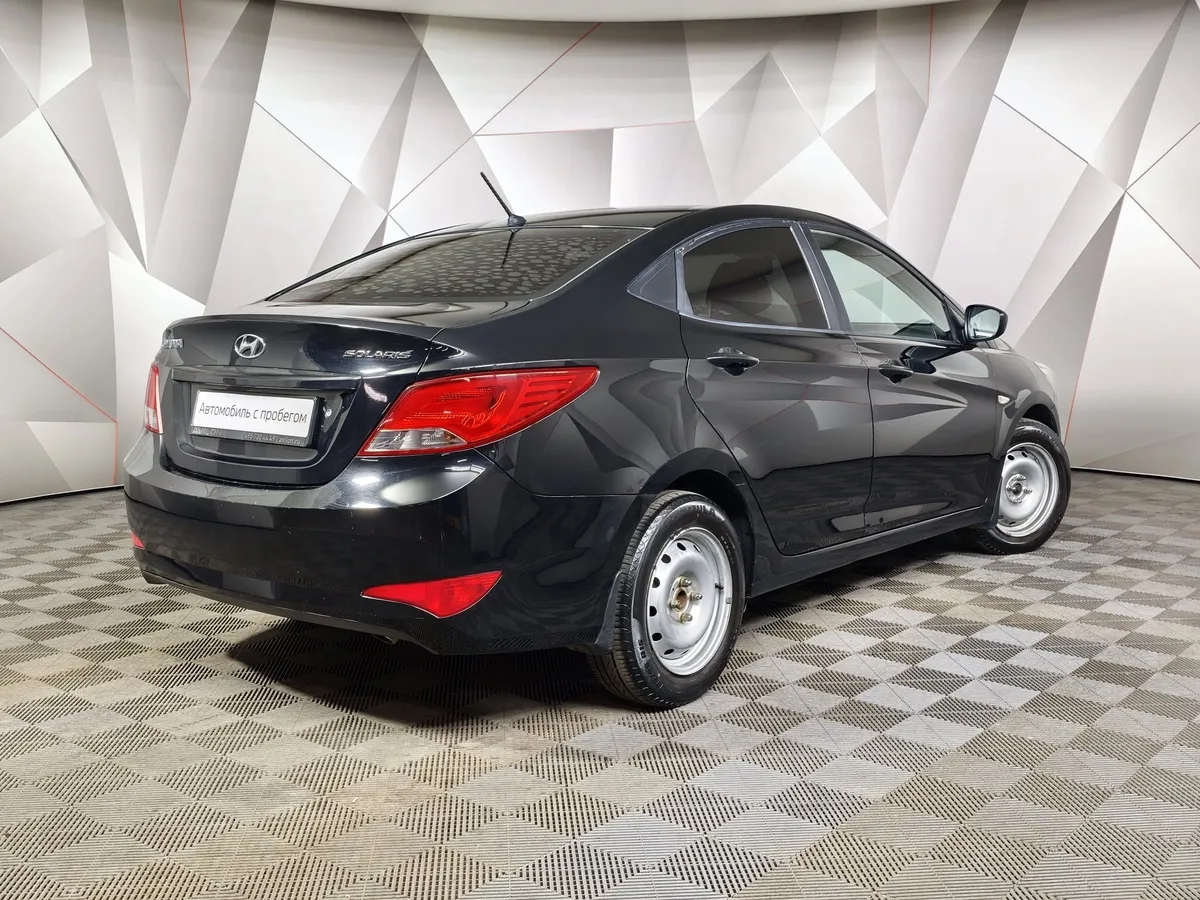 Hyundai Solaris 1.4 MT (107 л.с.) Comfort Черный в АВИЛОН. Слайд №2